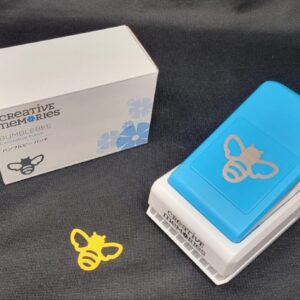 Creative memories bumblebee decorative punch, which is a blue and white box with a bee on it